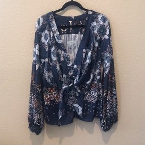 Free People Flowy Navy Blouse with White and Orange Floral Design